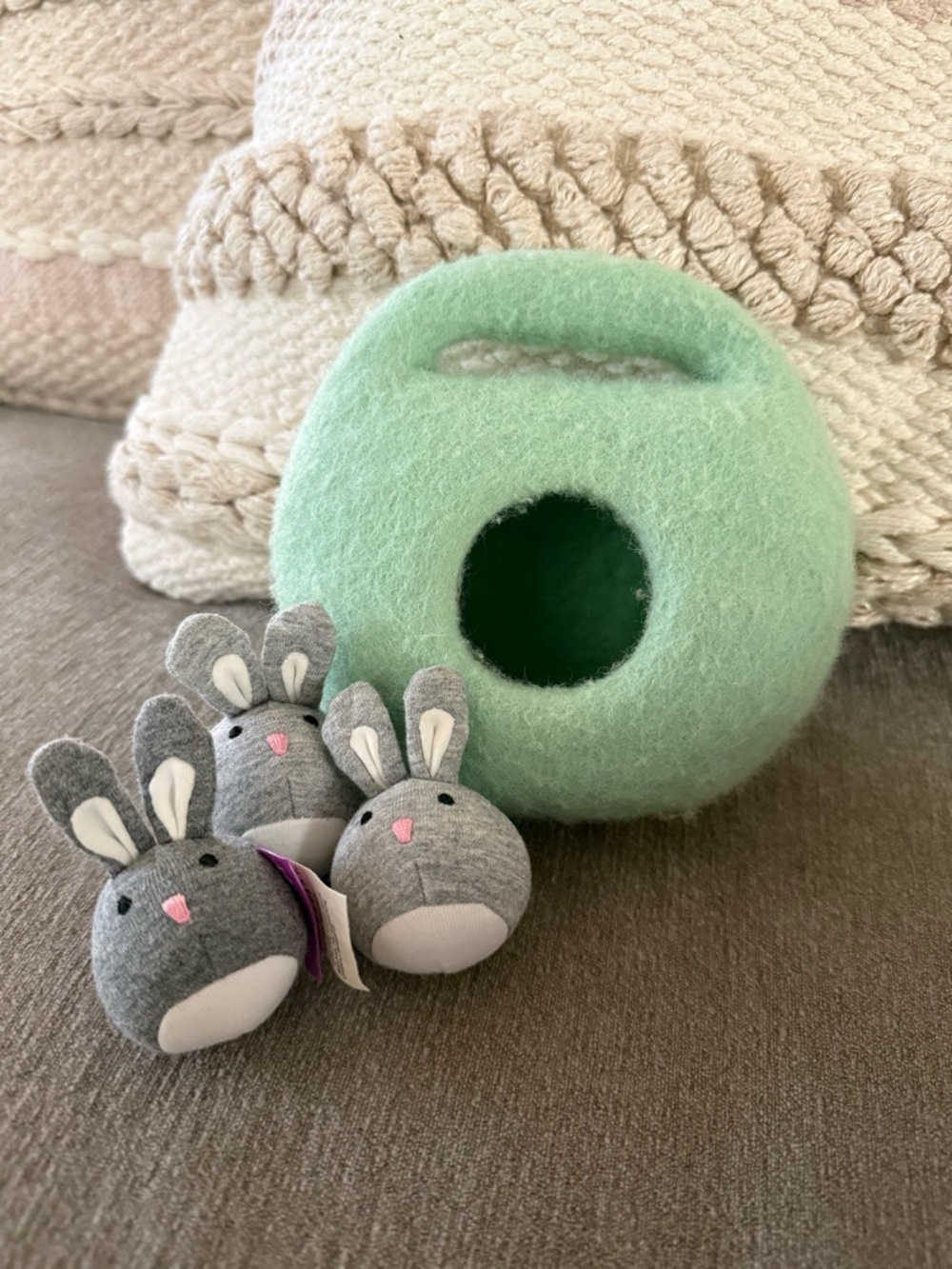 Lovevery bunnies in a felt burrow